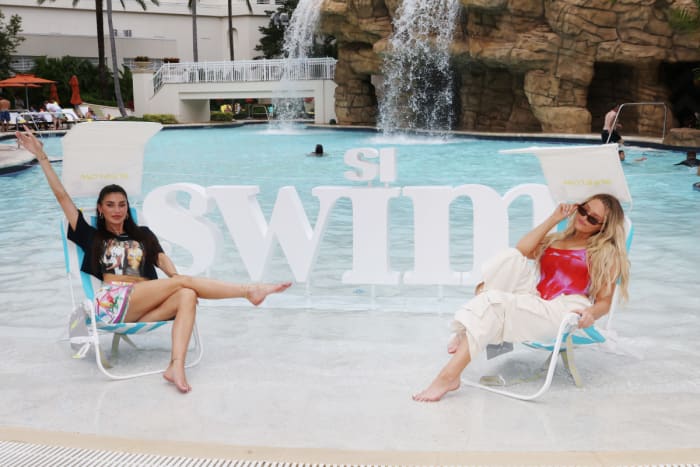 Nicole Williams English and Camille Kostek in Sunflow chairs.